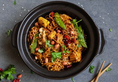 Delicious and spicy homemade meal / Stir Fried Sichuan Mala Noodle with Pork  / Pork slices, assortments of dried peppercorn, chili pepper to give the exclusive flavors and tongue numbing spiciness